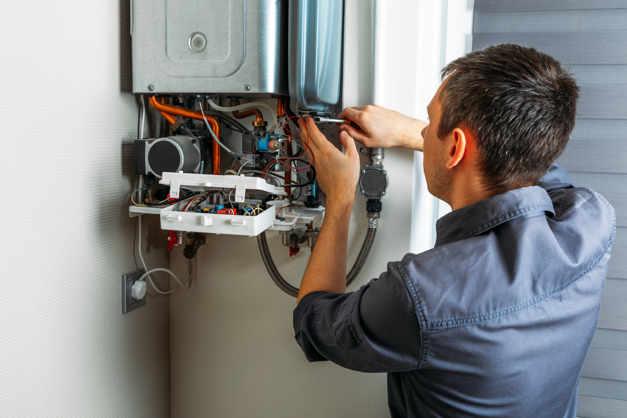 plumber attaches trying to fix the problem with the residential